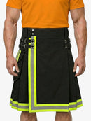 Black kilt with reflective yellow trim worn by a person in an orange shirt.