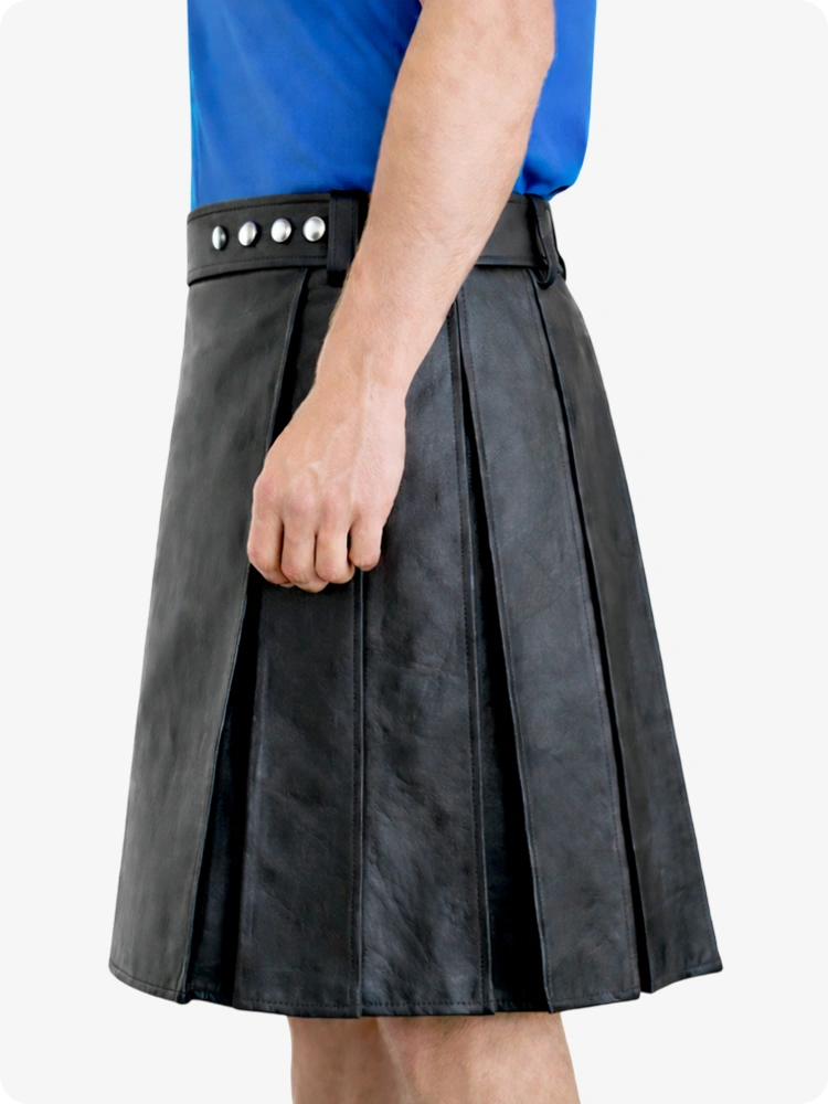 Black pleated skirt worn by a person on a white background