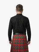 Man wearing a black shirt and red plaid kilt on a white background