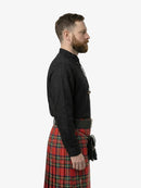 Man wearing a black shirt and red plaid kilt on a white background