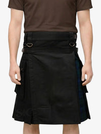 Person wearing a black kilt with plaid accents on a white background