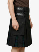 Black kilt with leather belt and plaid lining worn by a person on a white background