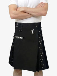 Black kilt with silver accents worn by a person on a white background
