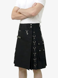 Black kilt with silver buttons and rings worn by a person on a white background