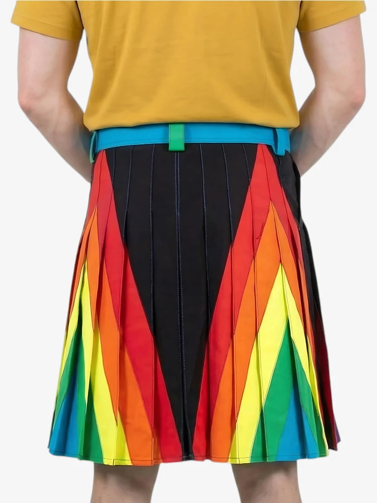 Person wearing a colorful skirt with rainbow pattern and black pleated section on a white background