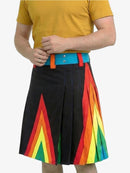 Person wearing a yellow shirt and a black skirt with rainbow patterns on a white background