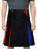 Person wearing a black kilt with colorful side panels on a white background