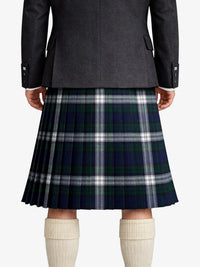 Person wearing a dark gray coat with a plaid kilt on a white background
