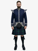 Man wearing a traditional Scottish Black Watch Tartan kilt with a navy jacket on a white background