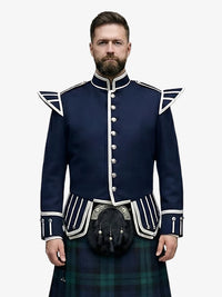 Man wearing a navy blue doublet jacket with white accents and a black watch tartan kilt on a white background