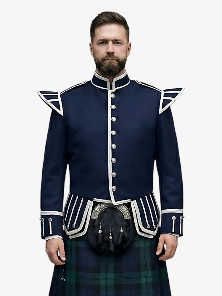 Man wearing a navy blue doublet jacket with white accents and a black watch tartan kilt on a white background