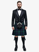 Man wearing a traditional Scottish black watch tartan kilt with a black prince charlie jacket on a white background