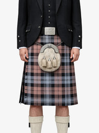 Person wearing a traditional Scottish kilt with a sporran on a white background