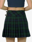Green plaid skirt worn by a person on a white background