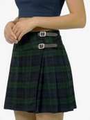 Plaid skirt with silver buckles worn by a person on a white background