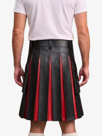 A man wearing a black pleated leather kilt with red vertical stripe accents, paired with a white t-shirt and white socks, shown from the back against a light gray background.