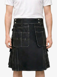 Person wearing a black kilt with white accents on a plain background