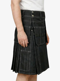 Black kilt worn by a person on a white background