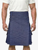 Man wearing a blue denim kilt on a white background