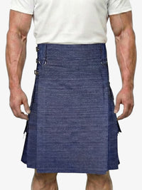 Man wearing a blue denim kilt on a white background
