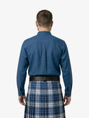 Man wearing a blue shirt and plaid kilt on a white background