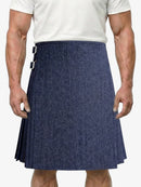 Man wearing a blue kilt on a white background