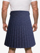 Person wearing a navy pleated kilt on a white background