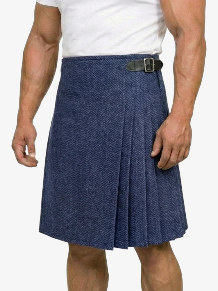 Person wearing a blue pleated kilt on a white background