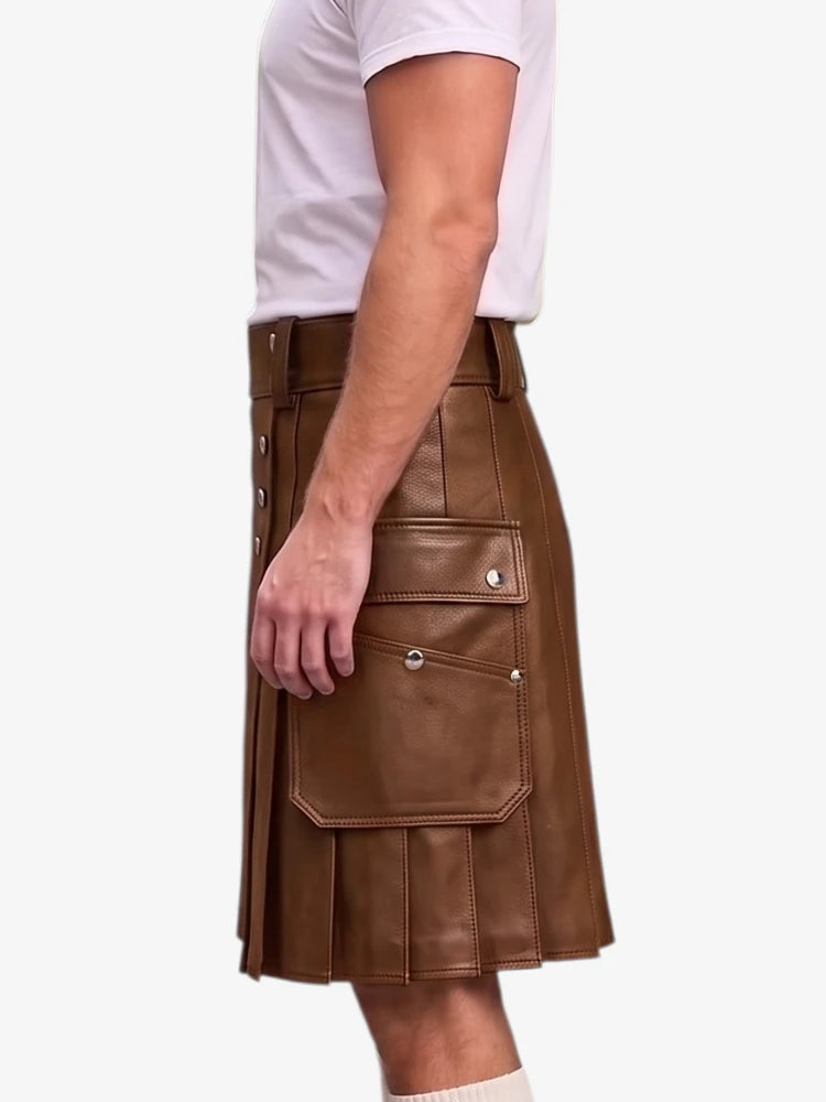 A side profile view of a person wearing a brown faux-leather kilt with multiple flap pockets and silver snap details, paired with a white t-shirt and white socks, against a light gray background.