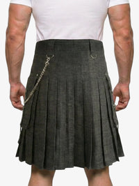 Person wearing a gray kilt with a chain detail on a white background