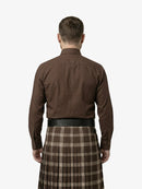 Man wearing a brown shirt and plaid kilt on a white background