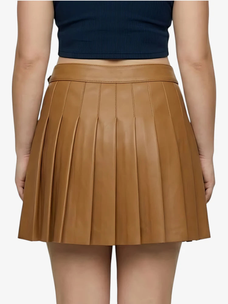 Brown pleated skirt worn by a person on a white background