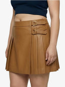 Brown pleated skirt with gold buckles worn by a person on a white background
