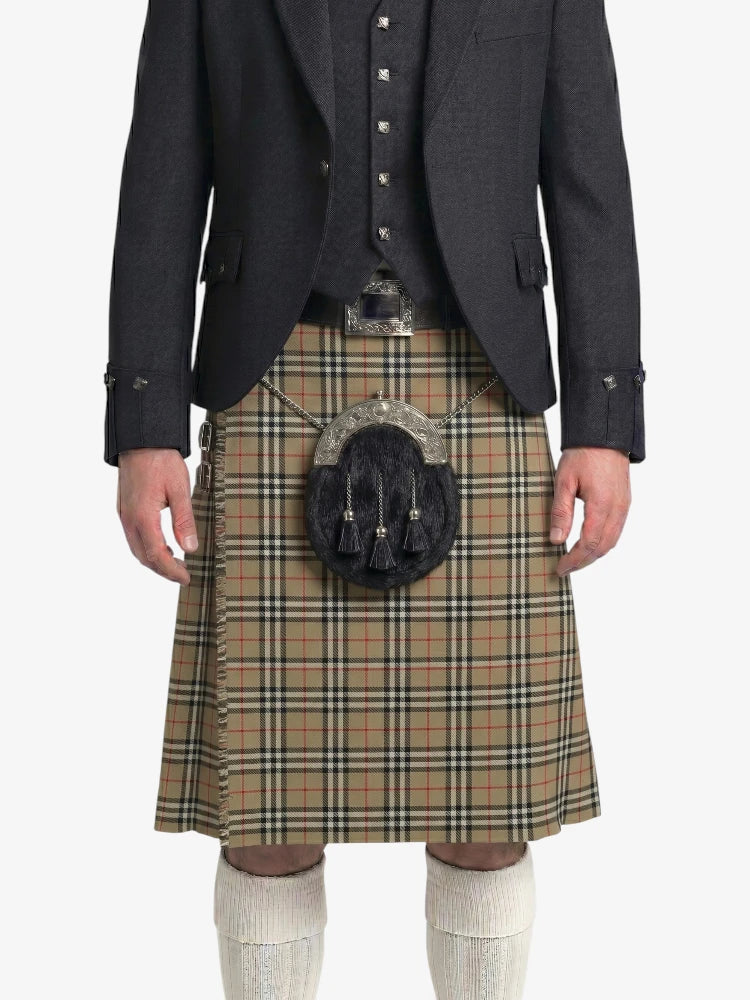 Traditional Scottish kilt with a dark jacket on a white background