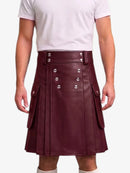 A maroon faux leather kilt with silver-tone double-breasted buttons and side flap pockets, worn by a model in a white t-shirt against a light gray background.