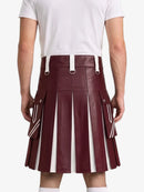 A maroon faux-leather pleated kilt with white stripe details and white belt loops, shown on a model from the back wearing a white t-shirt.