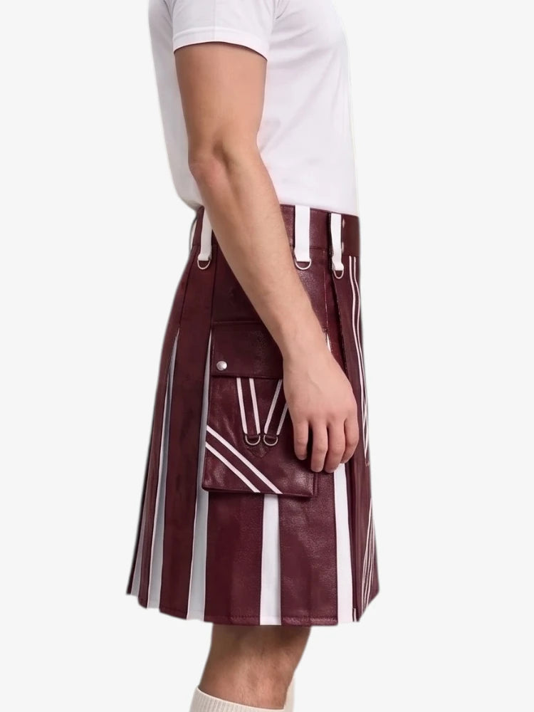 A side-profile view of a person wearing a pleated kilt in a deep burgundy faux leather with bold white vertical stripes and white drawstrings, paired with a white t-shirt against a plain white background.