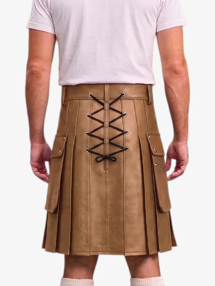 A person shown from the back wearing a tan pleated kilt with black lace-up detailing down the center and side cargo pockets, paired with a light pink t-shirt and white socks against a plain white background.
