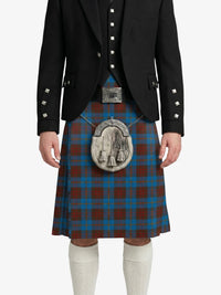 Person wearing a traditional Scottish kilt with a tartan pattern on a white background