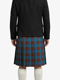 Person wearing a black jacket and a red and blue plaid kilt on a white background