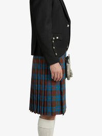 Person wearing a black jacket and plaid kilt on a white background