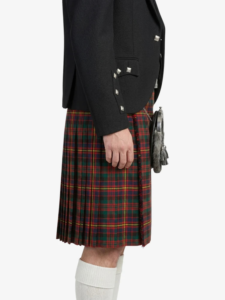 Person wearing a black jacket and red plaid kilt on a white background