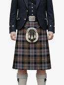 Traditional Scottish kilt with a dark jacket and white belt on a white background