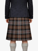 Person wearing a dark jacket and plaid kilt on a white background