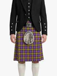 Person wearing a Scottish kilt with a tartan pattern on a white background