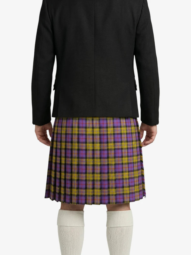 Person wearing a black jacket and a purple and yellow plaid kilt on a white background