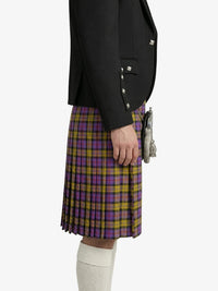 Person wearing a black jacket and a purple and yellow plaid kilt on a white background