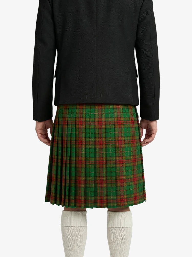 Person wearing a black jacket and green plaid skirt on a white background