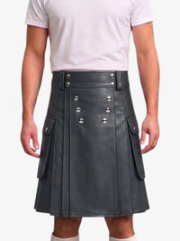 A person wearing a dark gray faux-leather kilt with silver-tone metal rivets and flap pockets, paired with a light pink t-shirt, shown against a plain white background.