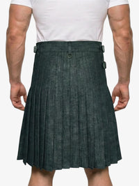 Person wearing a green pleated kilt on a white background